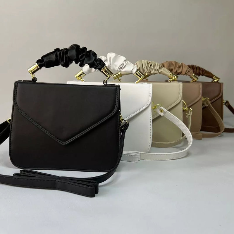 Bolsa transversal de mão feminina